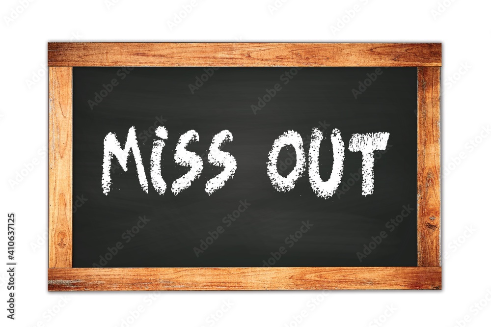 MISS OUT text written on wooden frame school blackboard. MISS OUT text written on wooden frame school blackboard.