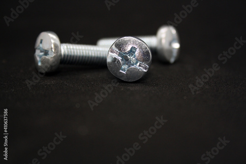 A set of bolts on a black background.