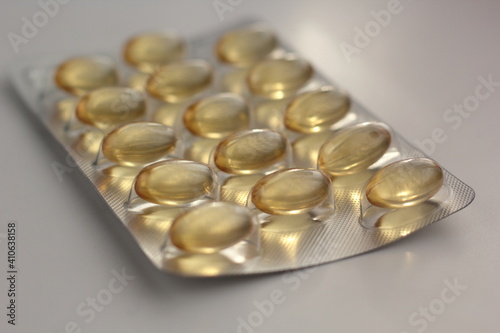 Closeup of a blister pack of vegan omega 3 capsules.