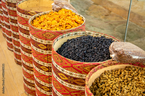 Closeupshot of seeds, fruits in the market. Dry fruits, mulberry and walnuts in the baskets photo