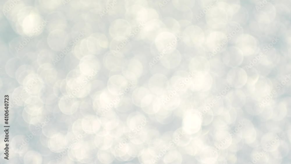 Abstract 4k stock video footage of beautiful sparkling light blue bokeh background
