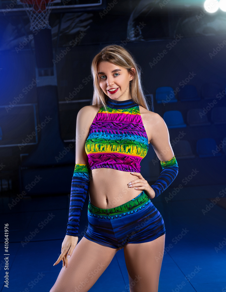 Sexy cheerleader girl posing opposite the basketball backboard with info  and game score. Poster hi-end retouch Stock Photo | Adobe Stock