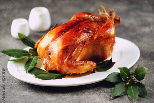Baked chicken with fresh bay leaf. Organic food.
