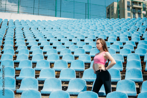 Teen Fitness, Physical activity for teenagers. Young sporty girl having workout, running, doing exercises on the stadium