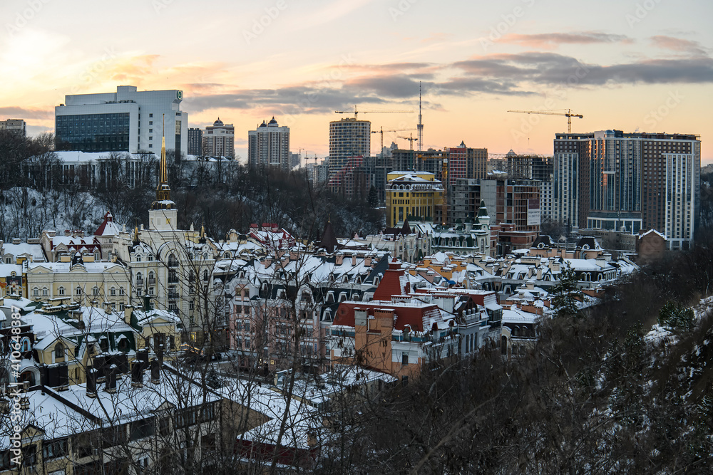 Evening winter view to Vozdvyzhenska street, new district on ancient historical area in Podil district of Kyiv, Ukraine.