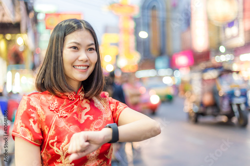 Beautiful chinese women in traditional red dress in Chinatown