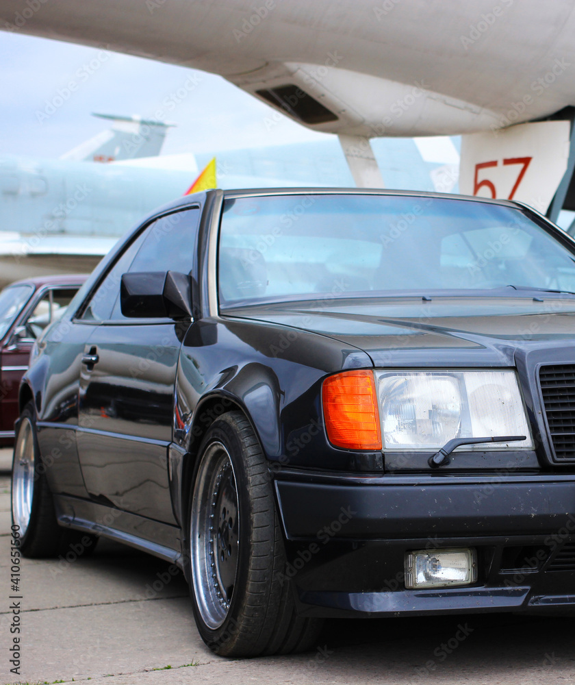 Black sports coupe Mercedes Benz 300 CE-24 W124. Stock Photo | Adobe Stock