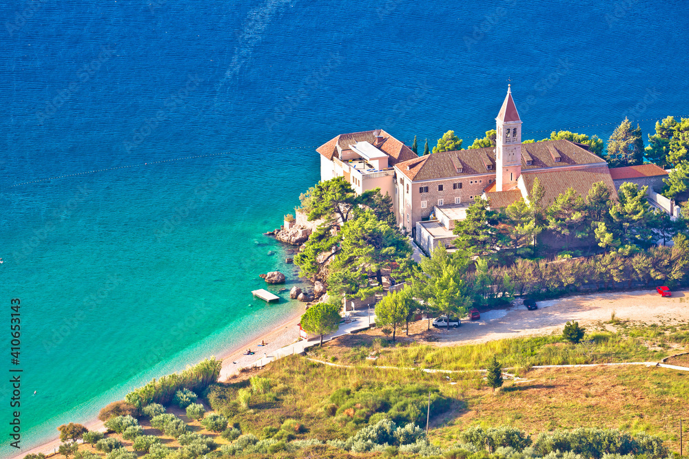 Turquoise beach in Bol on Brach island and church aerial view