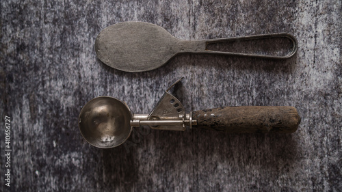 vintage ice cream spoons on gray background