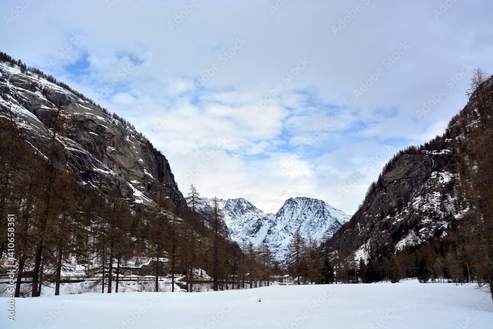 Snowy alpine landscape in Piedmont Alps, Italy.