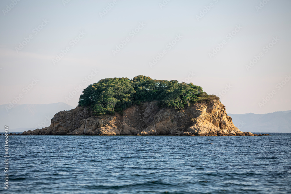 Big Rock in the blue waters of Paralia Vasilias, Skiathos, Skiathos Island, Greece.