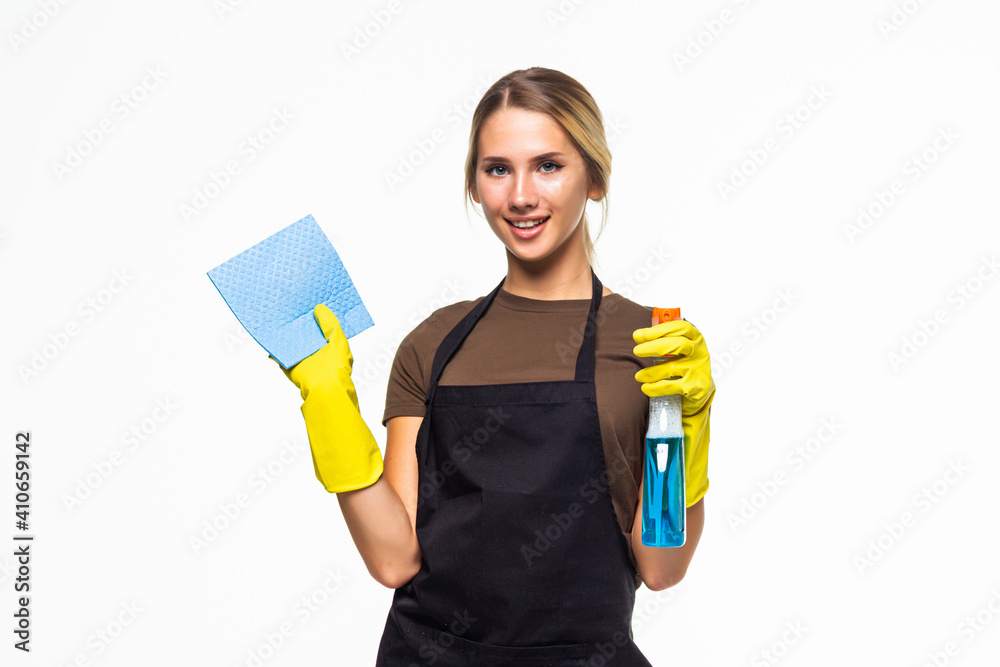 Young smiling cleaner woman with detergent and sponge isolated on white background. Young smiling cleaner woman with detergent and sponge isolated on white background.
