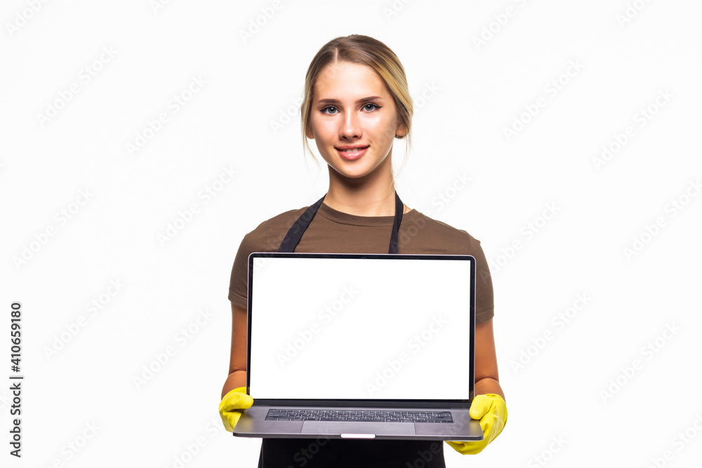Young housewife with apron holding a computer with screen to research online on a white background. Young housewife with apron holding a computer with screen to research online on a white background.