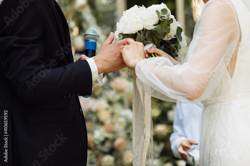 beautiful wedding ceremony. wedding arch on the background of the groom with nesty. happy newlyweds at the ceremony. visiting ceremony. a beautiful couple. photo