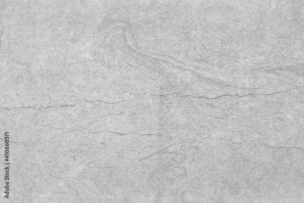 Naklejka premium Cardboard gray texture close-up. Light old paper background. Grunge concrete wall. Vintage blank wallpaper.
