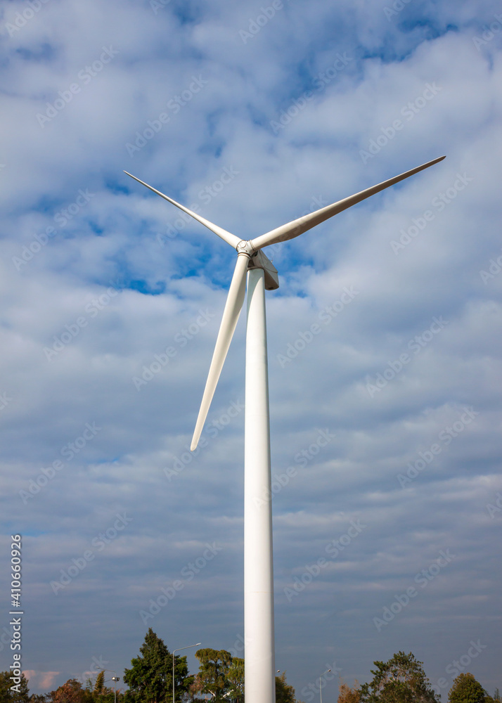 Wind turbine having a large vaned wheel rotated by the wind to generate electricity.. Wind turbine having a large vaned wheel rotated by the wind to generate electricity..