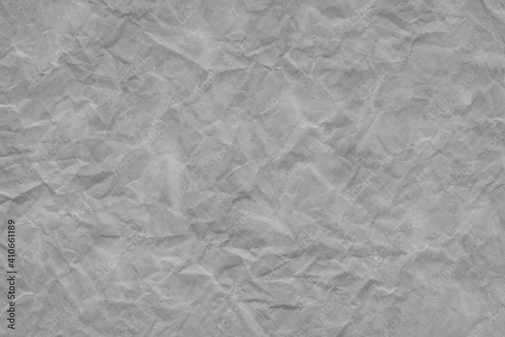 Cardboard gray texture close-up. Light old paper background. Grunge concrete wall. Vintage blank wallpaper.
