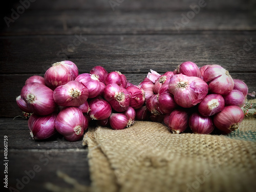 red onions on wooden background