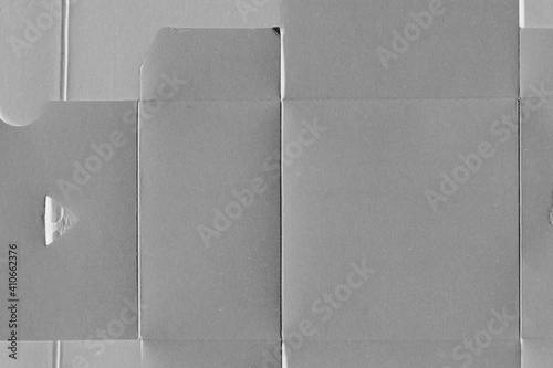 Cardboard gray texture close-up. Light old paper background. Grunge concrete wall. Vintage blank wallpaper.