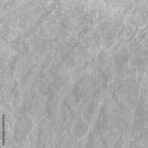 Cardboard gray texture close-up. Light old paper background. Grunge concrete wall. Vintage blank wallpaper.