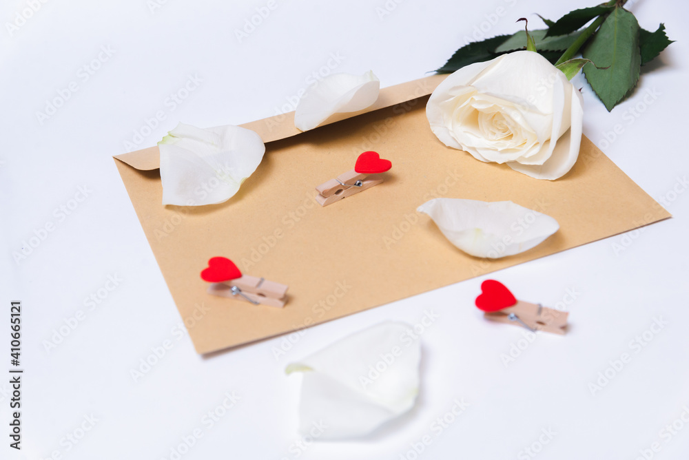 the rose lies on a paper envelope as a background. valentine's day celebration and eighth march concept
the rose lies on a paper envelope as a background. valentine's day celebration and eighth march concept