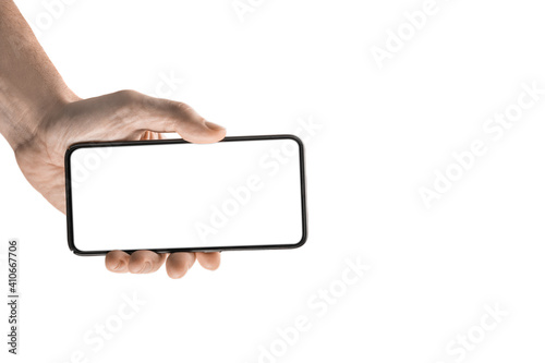 Mockup image, Man hand holding black cellphone, smartphone with white blank screen. Technology and advertising concept. Detailed closeup studio shot isolated on white