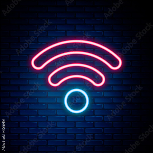 Glowing neon line Wi-Fi wireless internet network symbol icon isolated on brick wall background. Colorful outline concept. Vector.