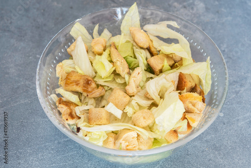 Caesar salad with toast, lettuce and grilled chicken breast