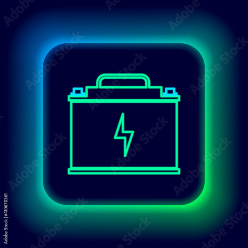 Glowing neon line Car battery icon isolated on black background. Accumulator battery energy power and electricity. Lightning bolt. Colorful outline concept. Vector.