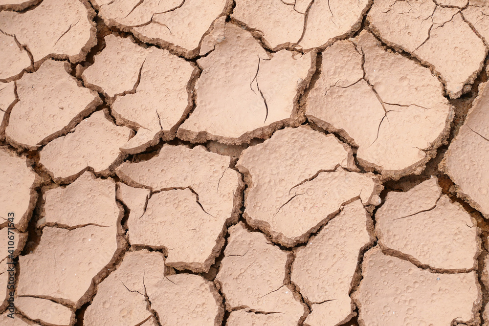Mudlands that previously contained water have cracked due to hot weather and drought. All water content has been evaporated by the heat Mudlands that previously contained water have cracked due to hot weather and drought. All water content has been evaporated by the heat