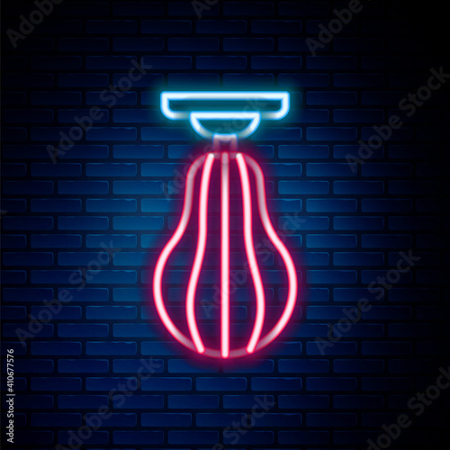 Glowing neon line Punching bag icon isolated on brick wall background. Colorful outline concept. Vector.