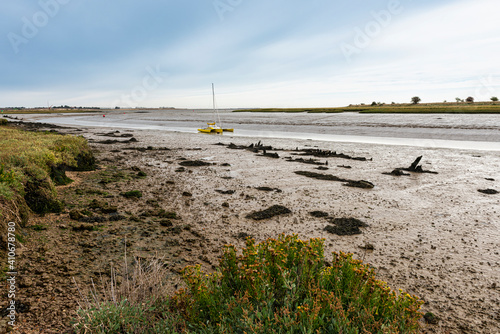 Boat on the Swale Estuary at low tide at Oare near Faversham in Kent  overlooking the isle of Sheppey