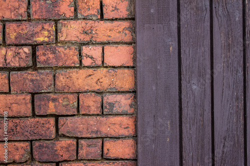 red rustic brick wall and old brown wooden house wall background