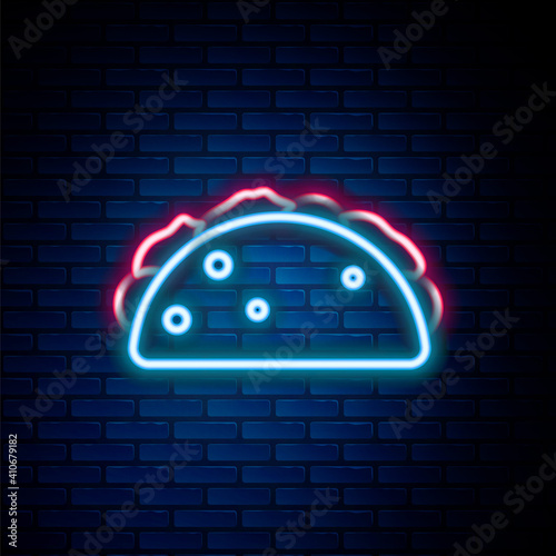 Glowing neon line Taco with tortilla icon isolated on brick wall background. Traditional mexican fast food menu. Colorful outline concept. Vector.