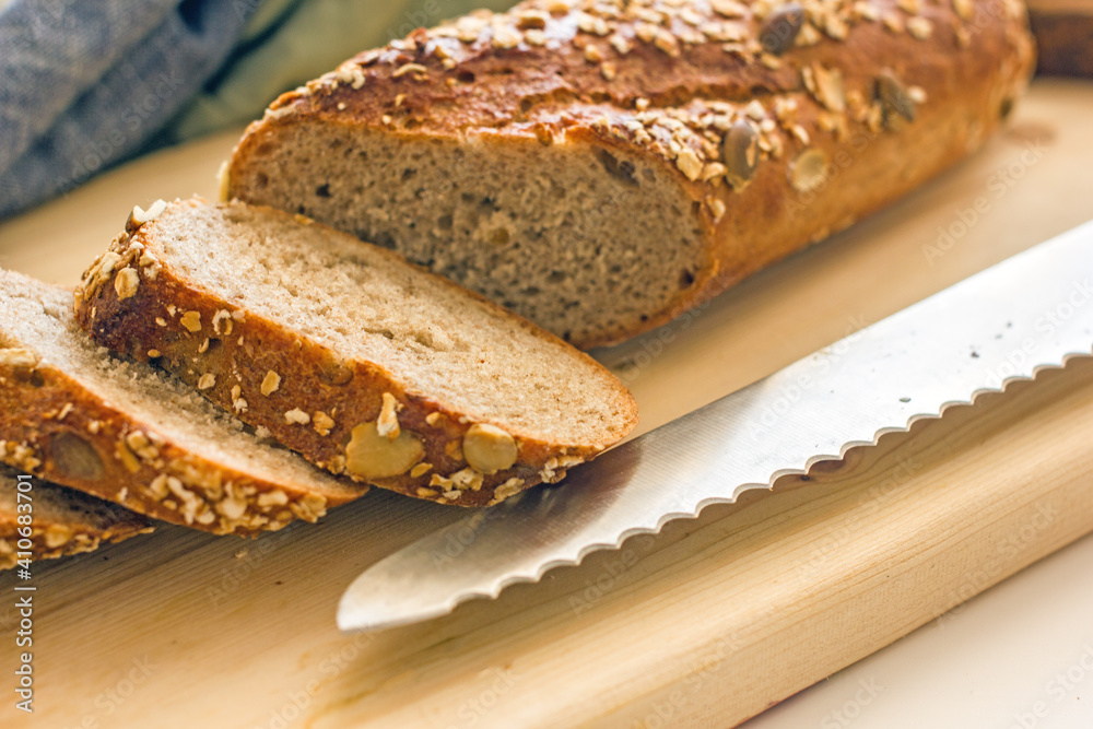 Sliced sourdough bread. A chopped loaf of homemade bread 