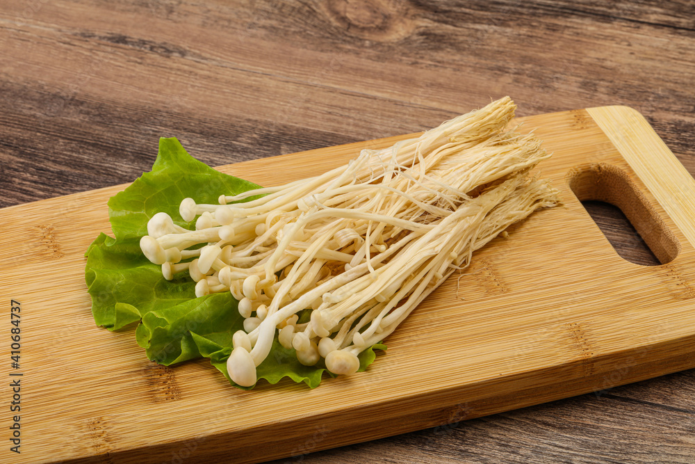 Raw Enoki mushrooms for cooking