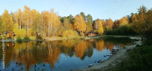 Autumn forest lake in Ural forest. Nature background. Copy space