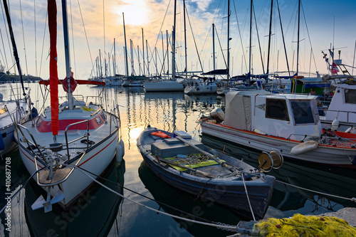 Various ships and boats in a marina of Thessaloniki, Greece at sunset © dinosmichail