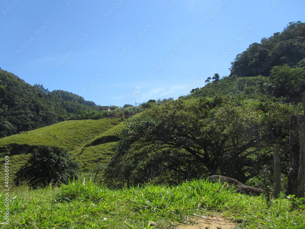 typical rural landscape in Brazil, with green hills 