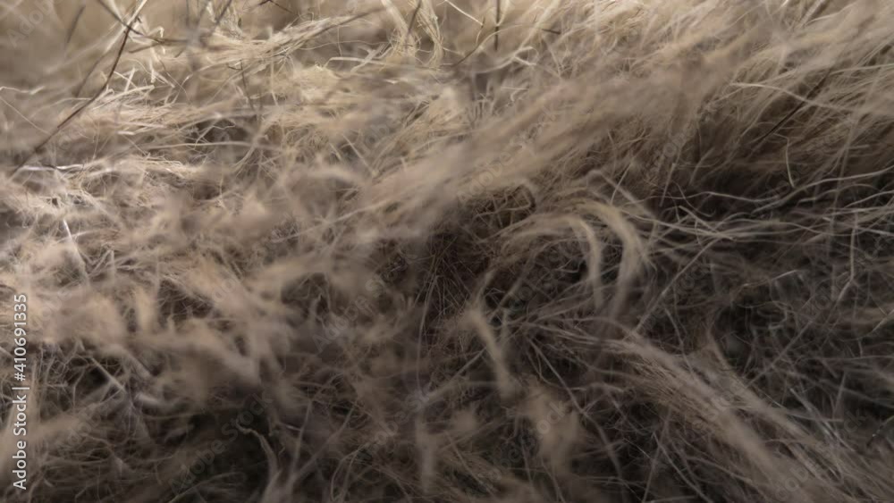 Faux fur on a macro close-up. Artificial plastic material imitates animal fur. Faux fur on a macro close-up. Artificial plastic material imitates animal fur.