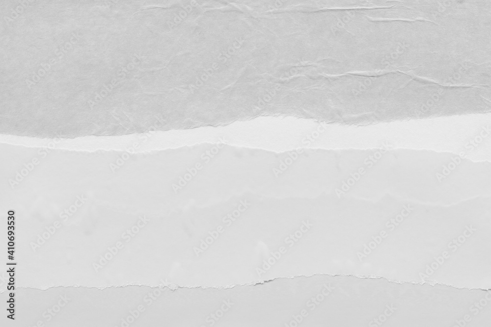 White torn paper collage close-up. Texture made from various paper and cardboard parts. Damaged old paper background. Vintage blank wallpaper. Material design backdrop. White torn paper collage close-up. Texture made from various paper and cardboard parts. Damaged old paper background. Vintage blank wallpaper. Material design backdrop.