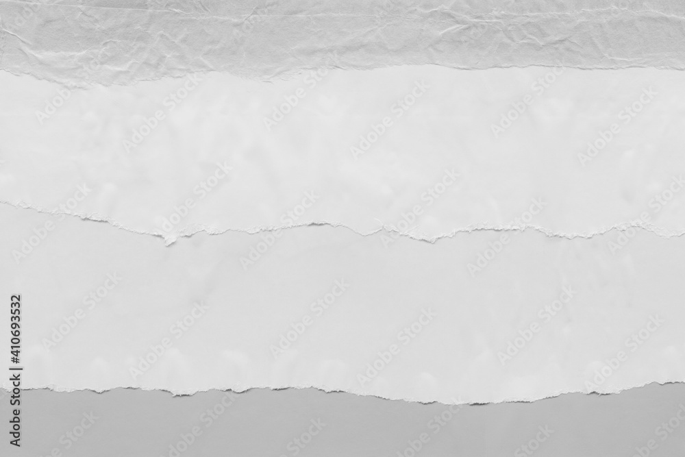 White torn paper collage close-up. Texture made from various paper and cardboard parts. Damaged old paper background. Vintage blank wallpaper. Material design backdrop. White torn paper collage close-up. Texture made from various paper and cardboard parts. Damaged old paper background. Vintage blank wallpaper. Material design backdrop.