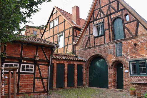 Lüneburg, Germany: In the courtyard of the historic building „Hospital zum Roten Hahn“, a former refuge for poor and sick people, 15th century. Now a residential building for artists. Europe.