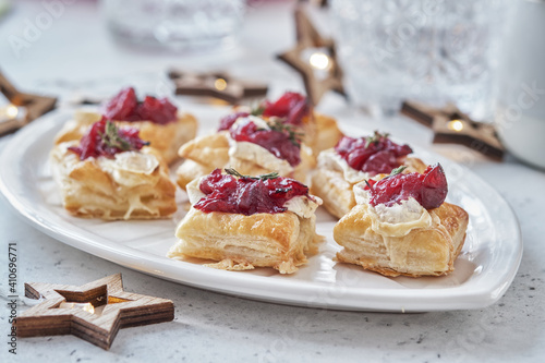Slika na platnu Holiday appetizers with cranberry sauce, brie cheese and thyme