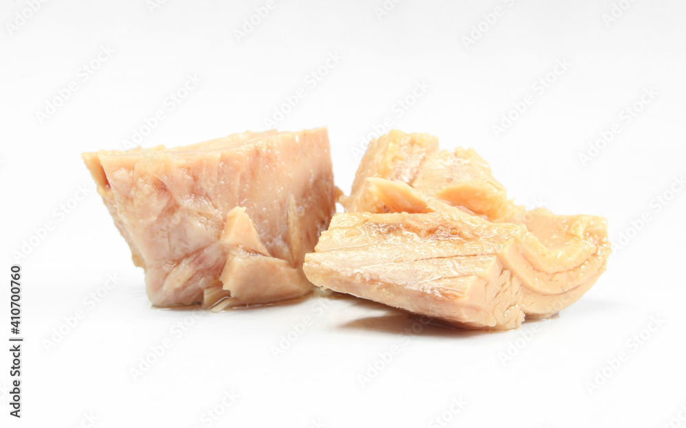 Pieces of tuna isolated on white background. Preserved and prepared fish meat Pieces of tuna isolated on white background. Preserved and prepared fish meat