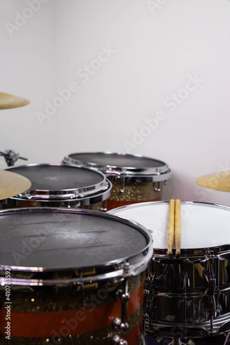 Closeup of drumsticks lying on the professional drum set. Drummer equipment. 