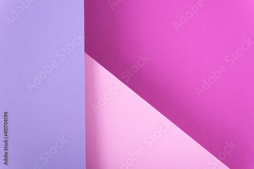 Abstract pink colored paper texture. Geometric shapes and lines. Minimalist background. Flat lay. Copy space.