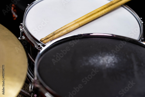 Closeup of drumsticks lying on the professional drum set. Drummer equipment. 