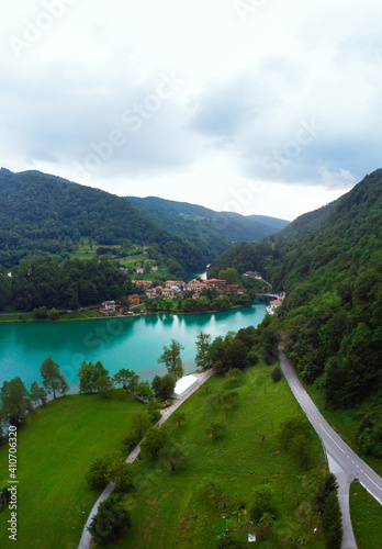 aerial view of Most Na Soci lake in beautiful colors near Tolmin in Slovenia. Summer cloud day. Mountains. Travel and vacation. Modrej, Modrejce. vertical photo.