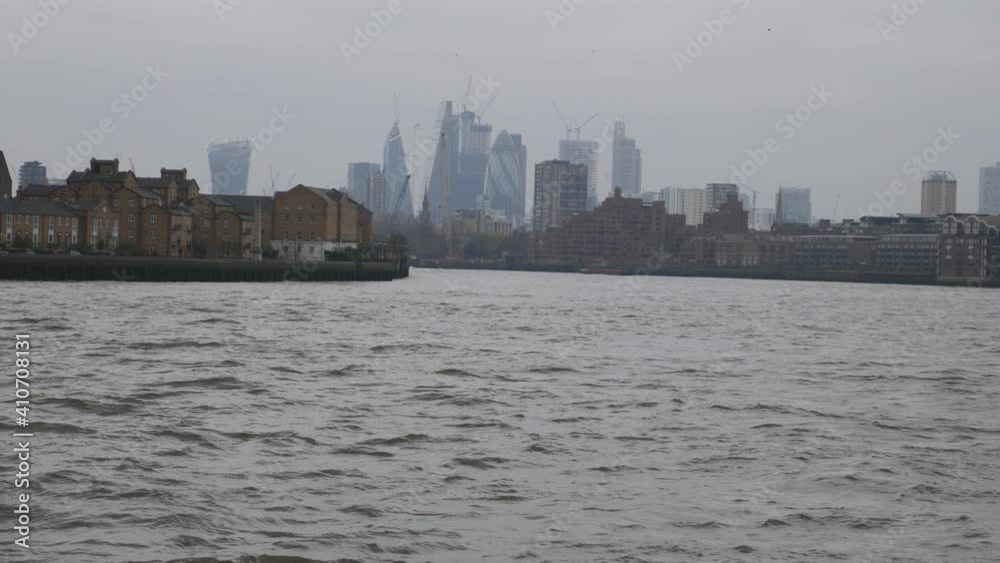 A view of a city across the river. A view of a city across the river.